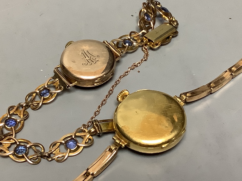 A lady's 1920's 18ct gold manual wind wrist watch, on a 15ct flexible strap, gross 21.3 grams, together with a similar 9ct gold wrist watch on a 14ct and gem set bracelet, gross 17.9 grams.